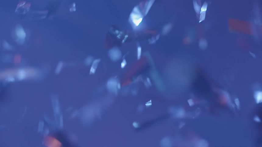 Small colored bits of paper fall