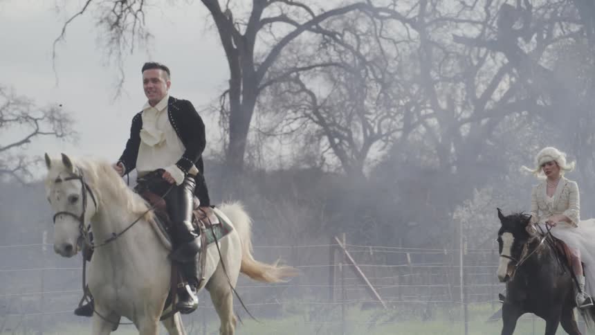 Man in period costume rides horse