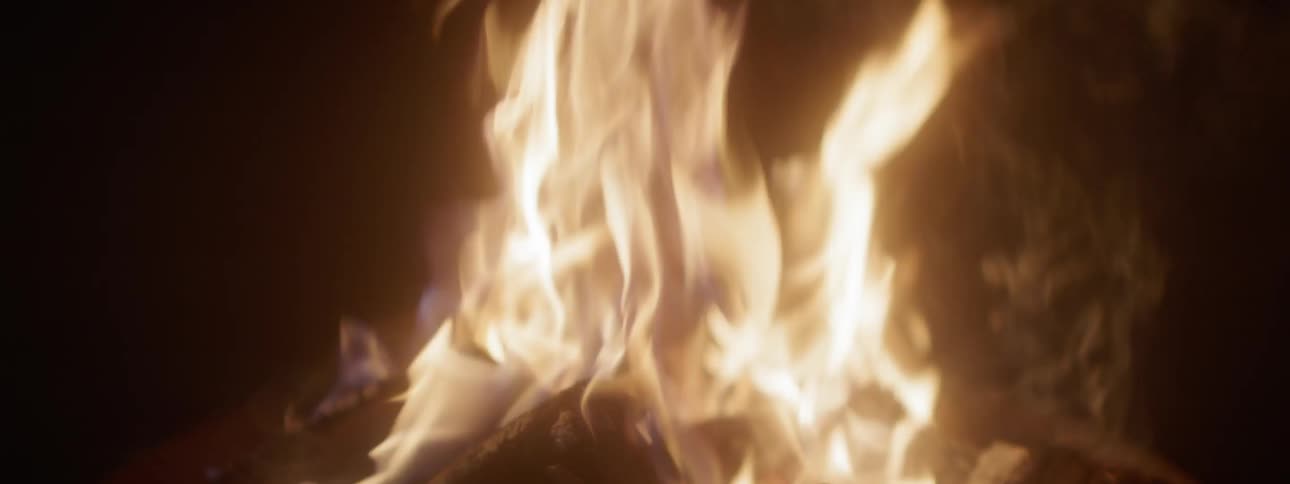 Fire blazes brightly at night
