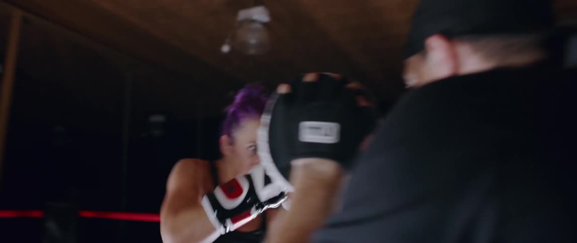 A woman trains in a boxing ring