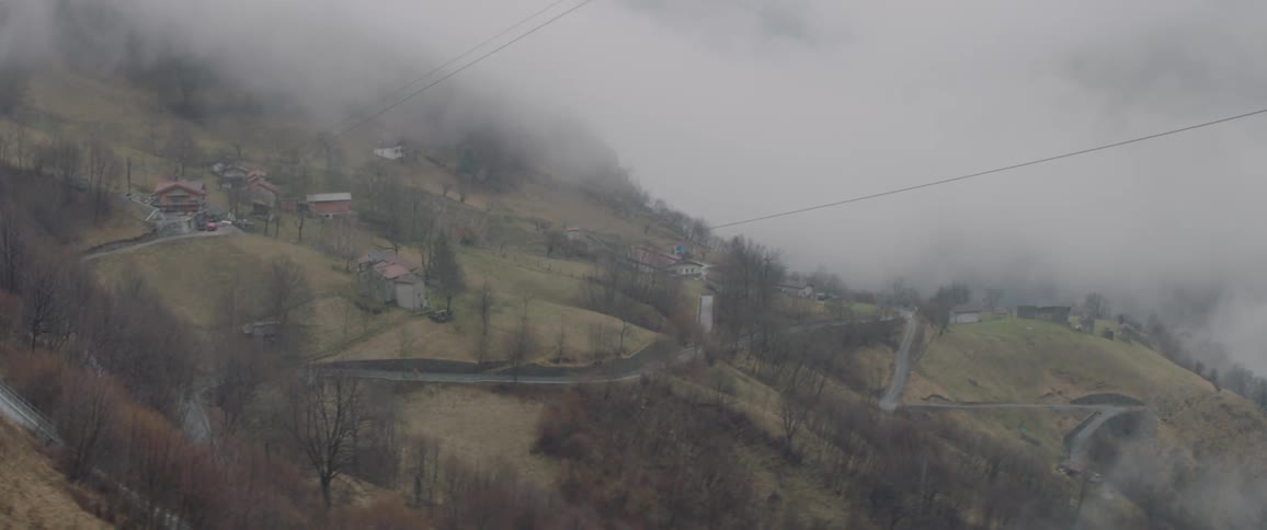 Aerial view of a hillside in the fog