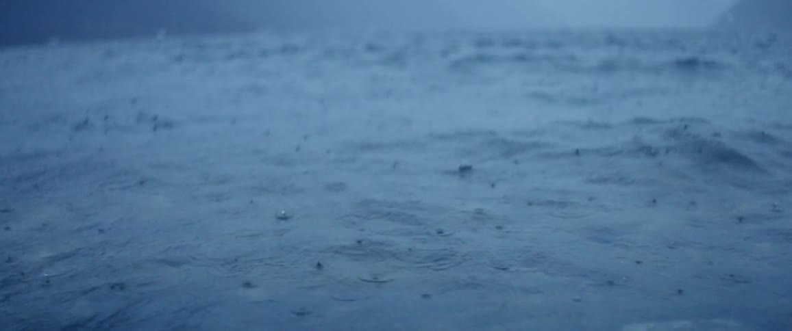 Rain hitting water