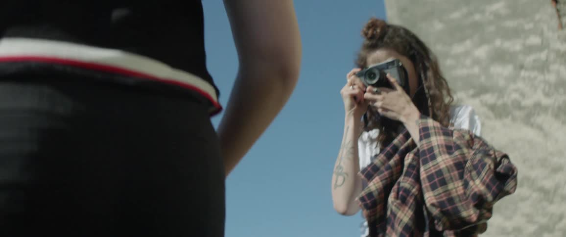 Woman smiles and takes a picture