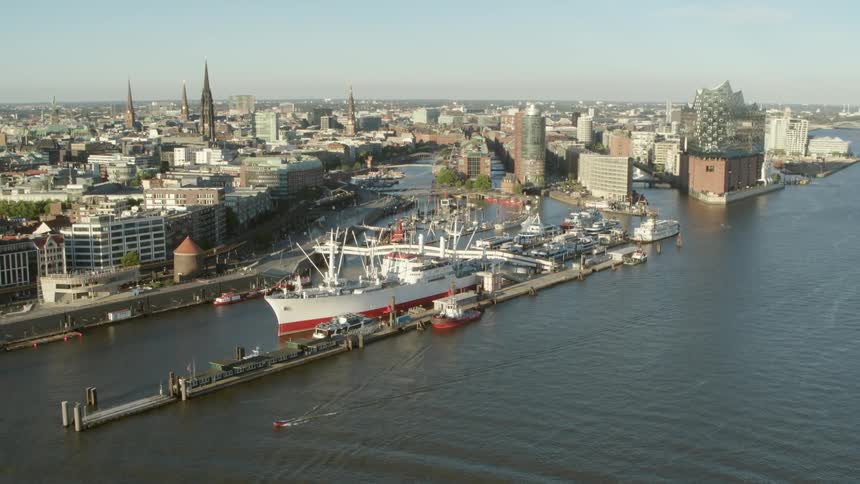 Hamburg Harbor - A large ship is docked by the city