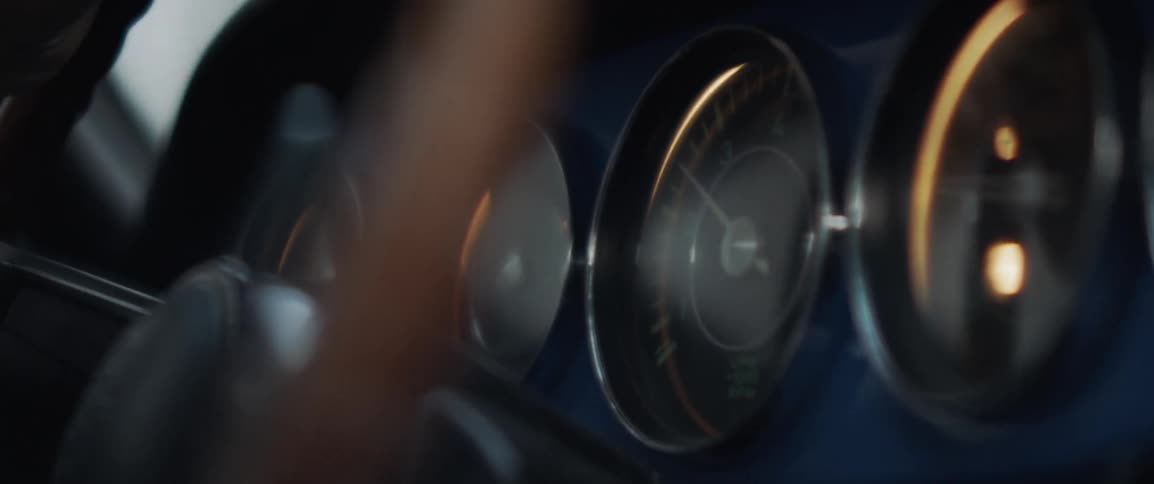A person steers the car as it shakes