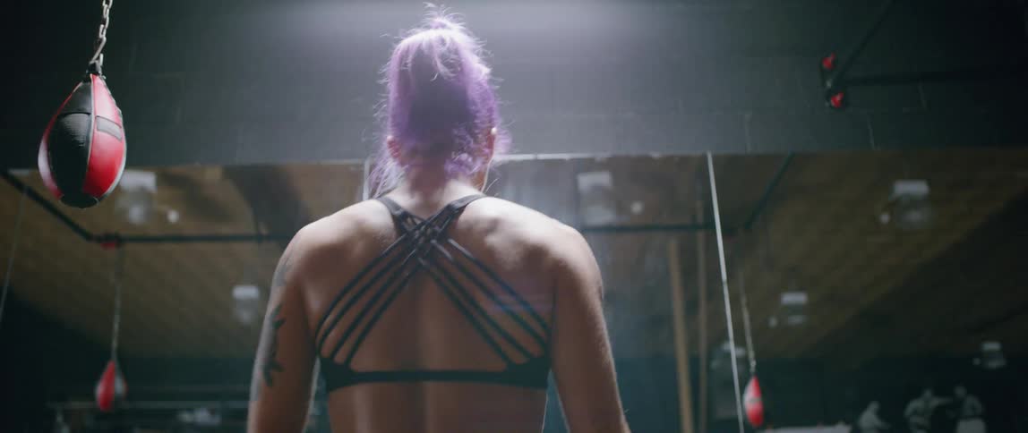 Woman warms up in boxing gym