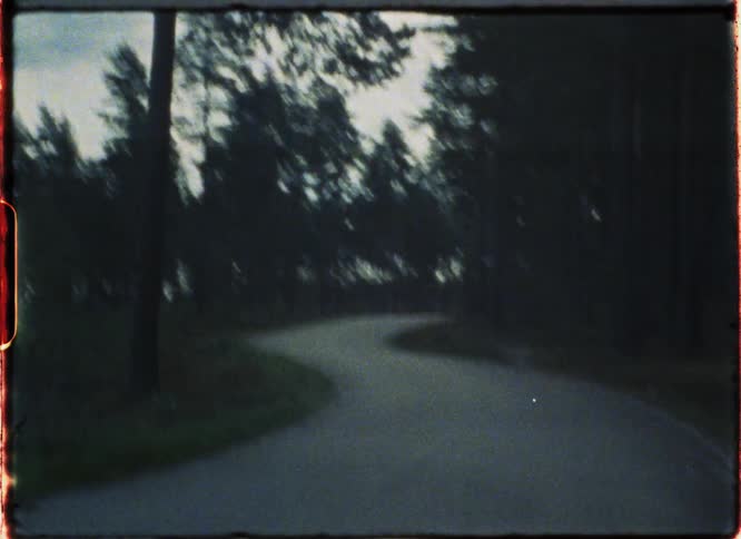 Winding country road at sunset