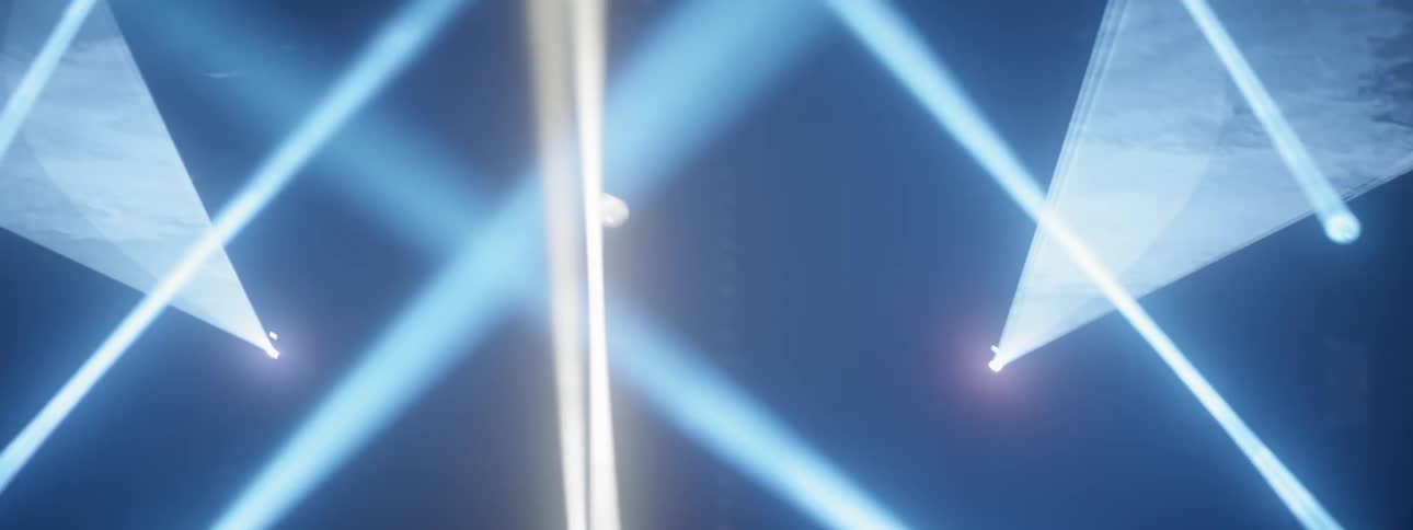 Spot lights and laser lights shine and flash