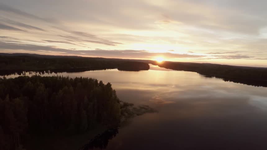 The sun sets over a lake