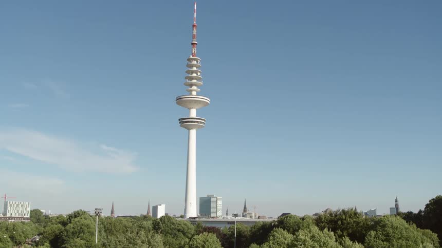 Tower behind many trees on a clear day in Hamburg