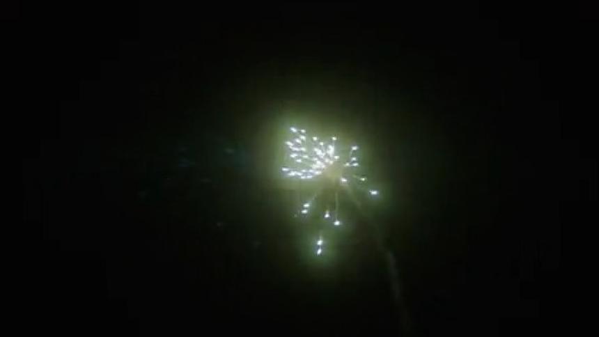 Small firework explodes in the night
