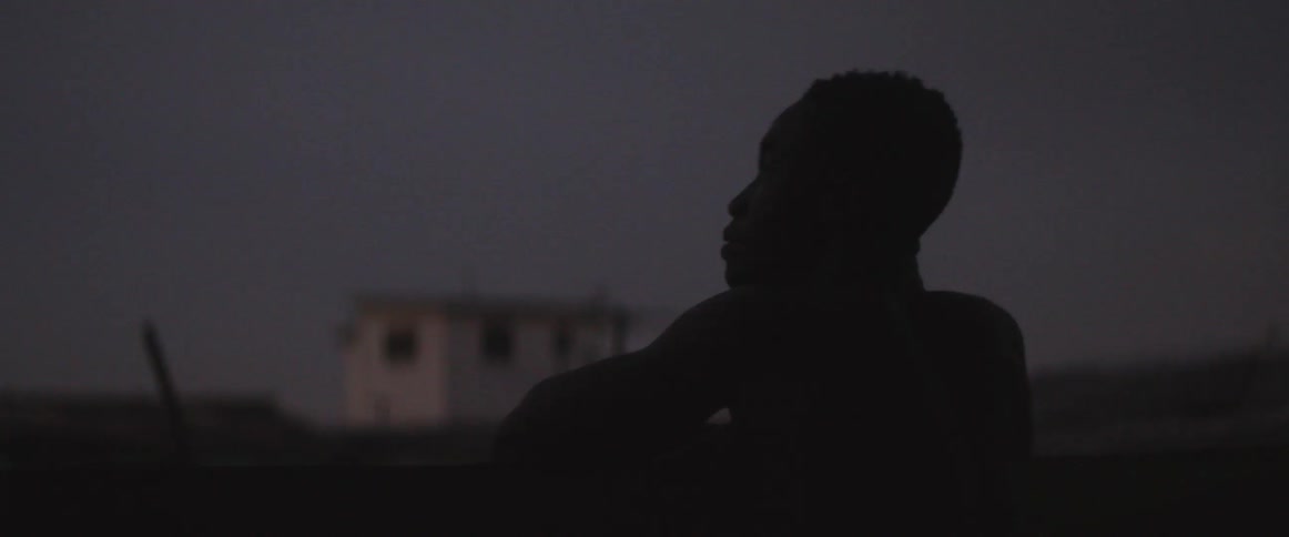 Person practicing boxing outside at night