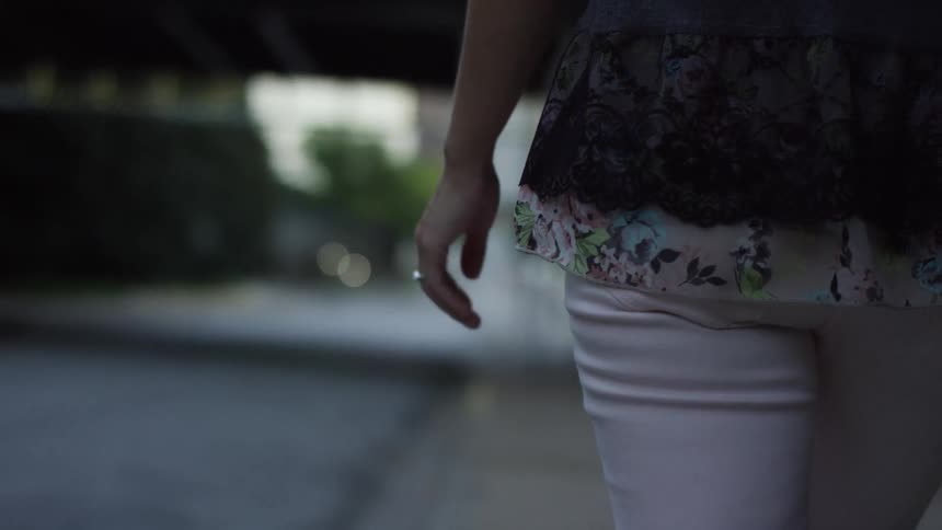 A person walking down a sidewalk
