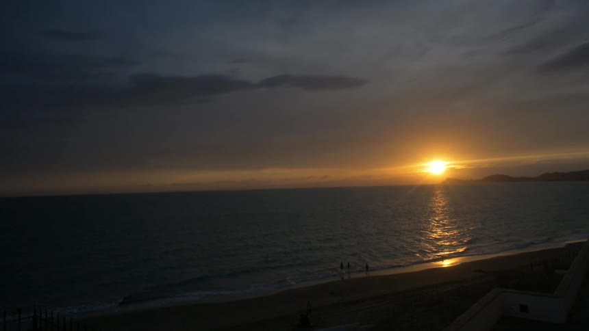 A sunset over an ocean horizon
