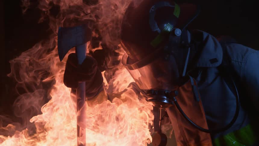 A firefighter battles the blaze