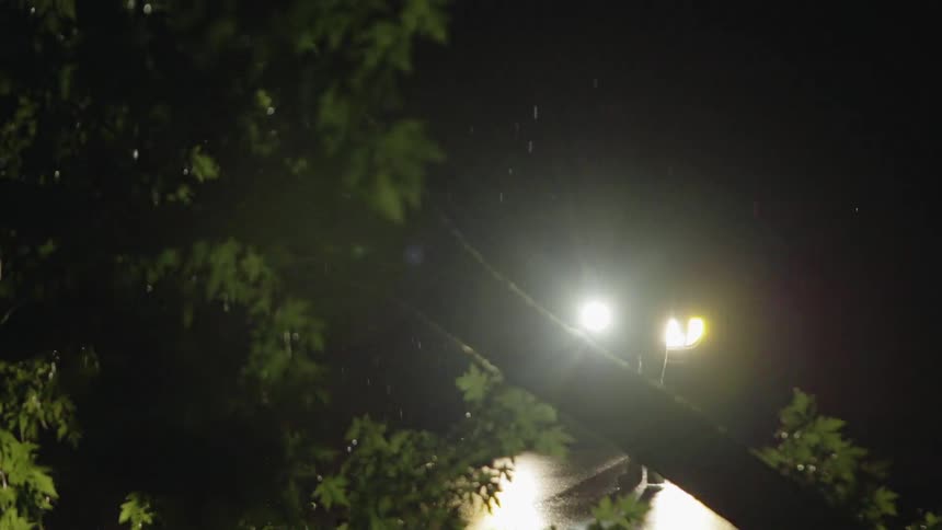 A person is searching in the dark with a flashlight