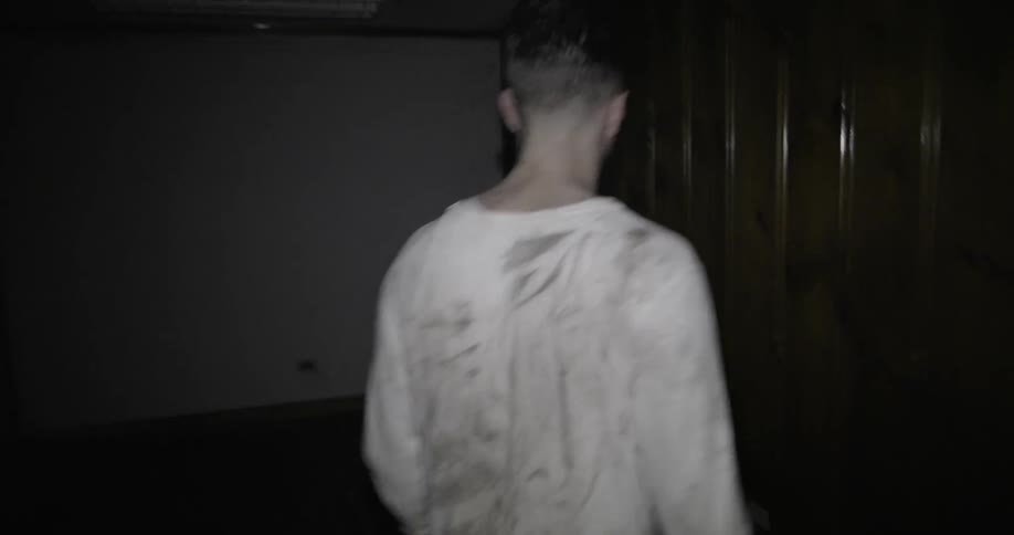 Man wandering around a house at night