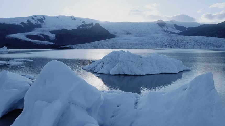 Water flows around icebergs in the antarctic