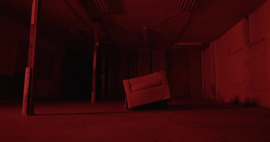 Chair tilted to its side and lights flash overhead