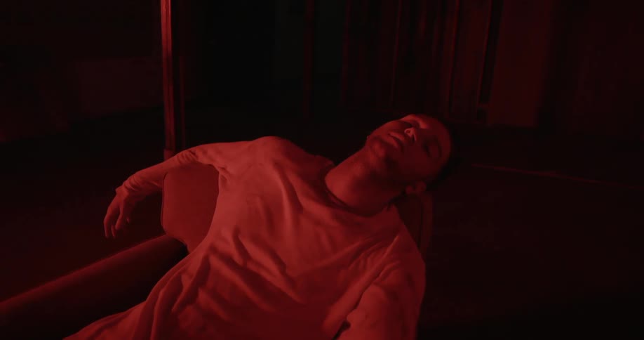 Man lays back in a chair