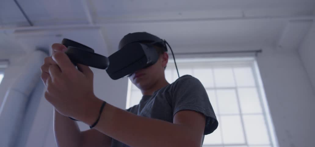 A man uses a vr headset in an empty room