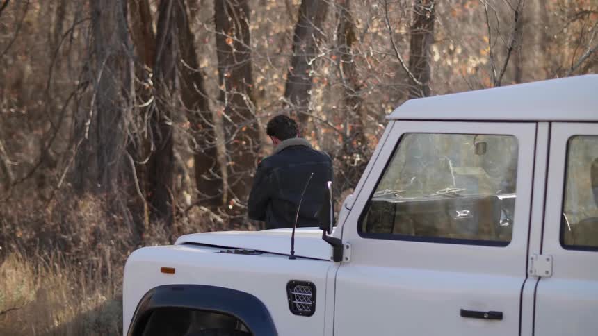 Person in a van in the forest