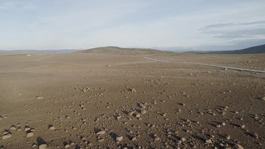 The desert leads out into the distance on a sunny day