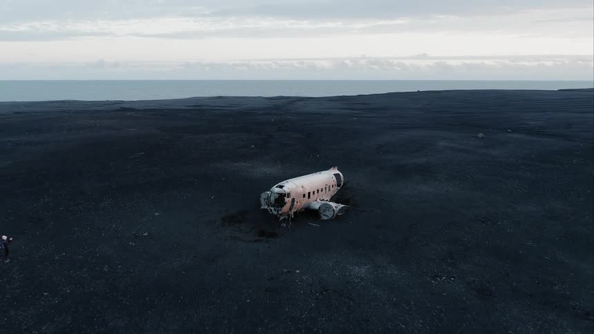 Plane wreckage sits in a remote field
