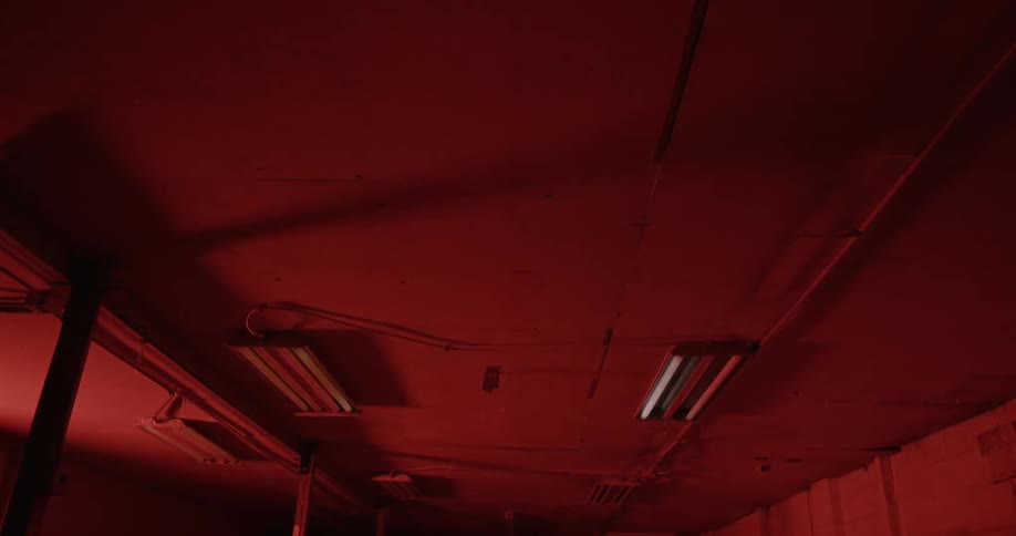 The lights flicker in the dark hall
