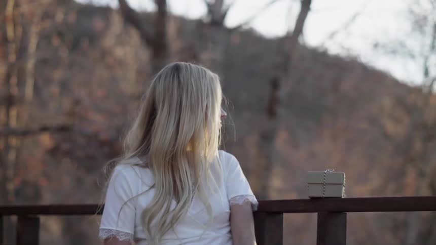 A woman looks out over the hills