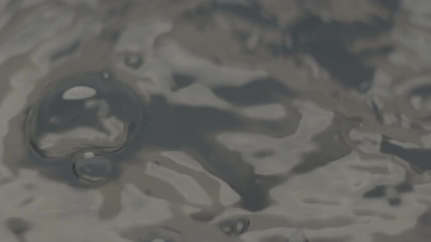 A key slowly falls into water