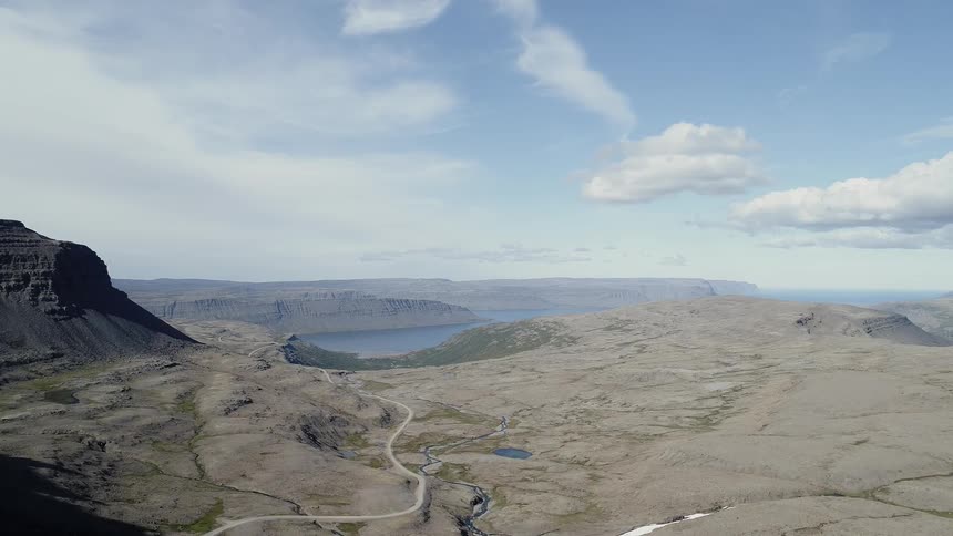 The canyon leads to a lake ahead