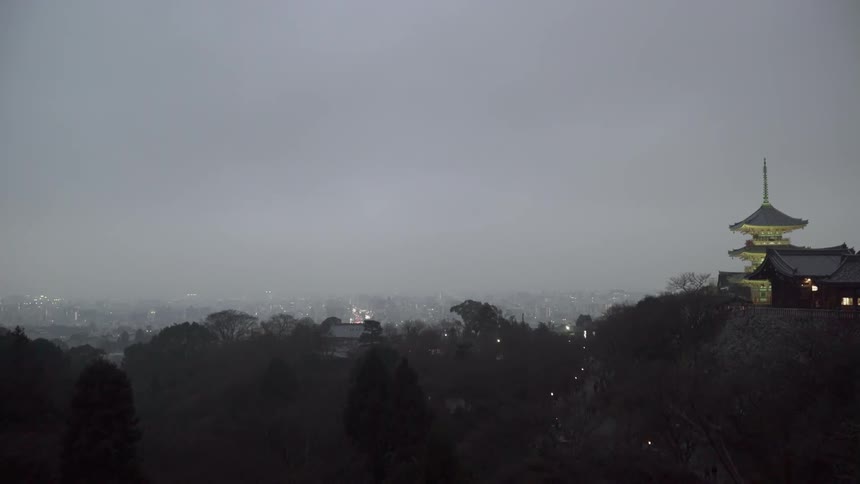 Fog and clouds float over the Tokyo skyline in the evening