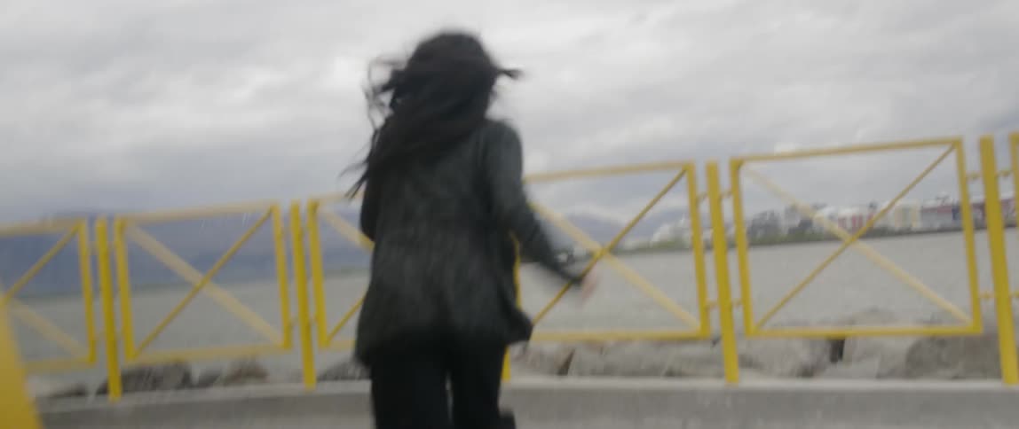 Woman smiles and runs back and forth