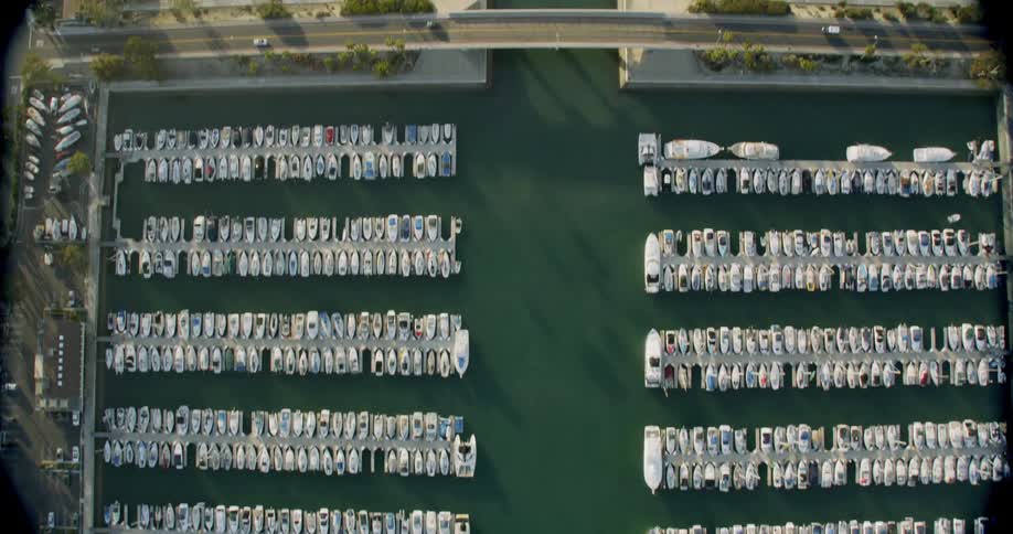 Rows of boats parked in a large harbor