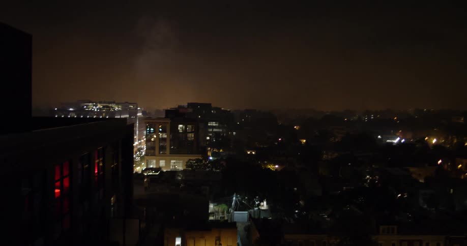 The spotlight shines by the buildings at night
