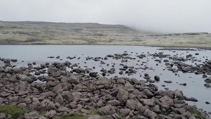 The pond is covered with rocks