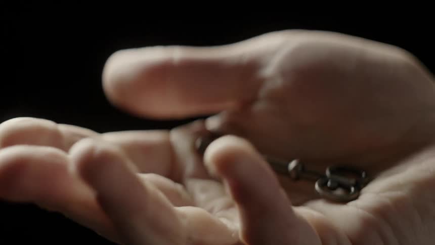 A person has a key in their hand