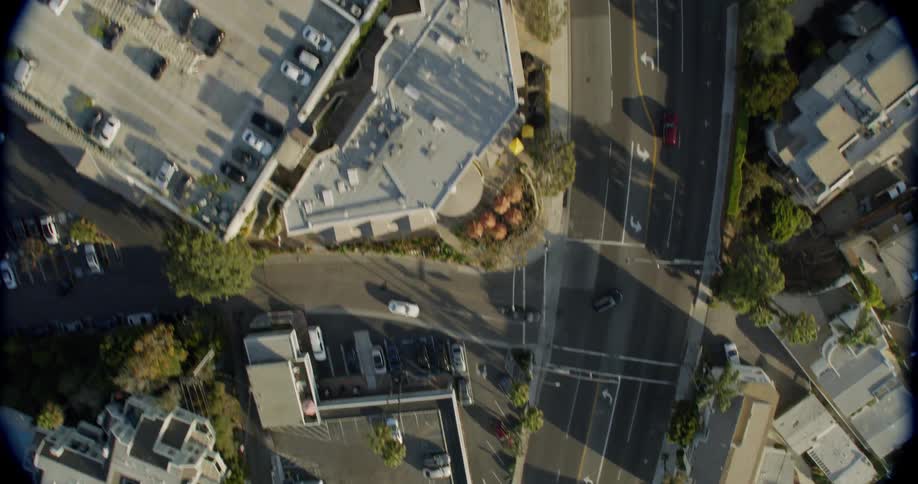 Cars drive in a city