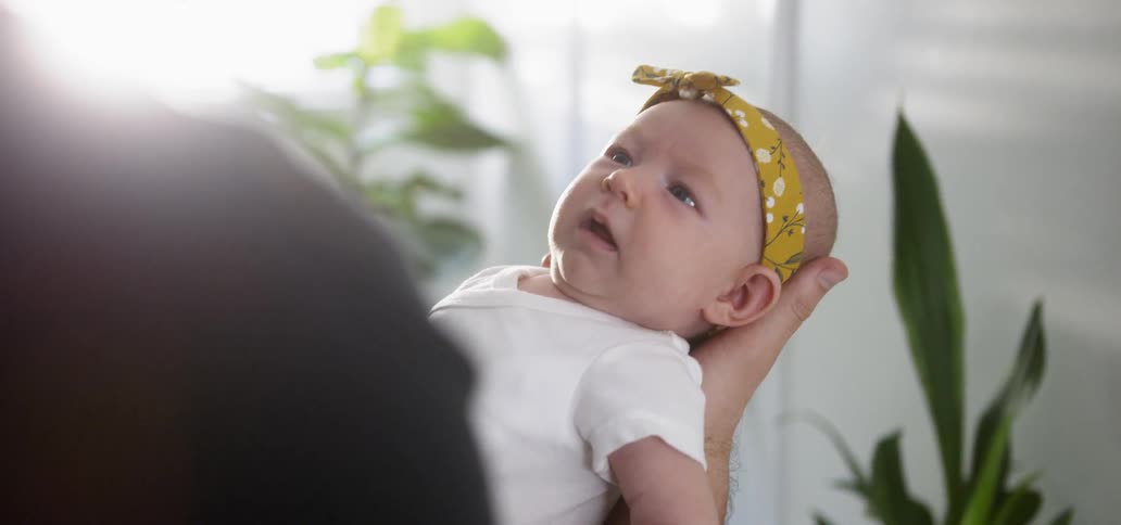 A person is rocking a baby