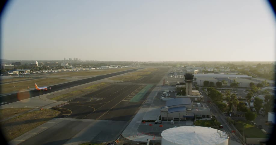 The runway has a plane taking off