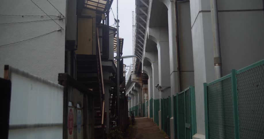 Buildings line a city sidewalk