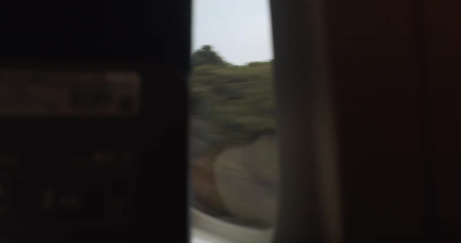 A person rides on a commuter train
