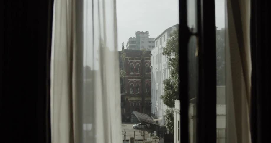 The wind blows the curtains of the window