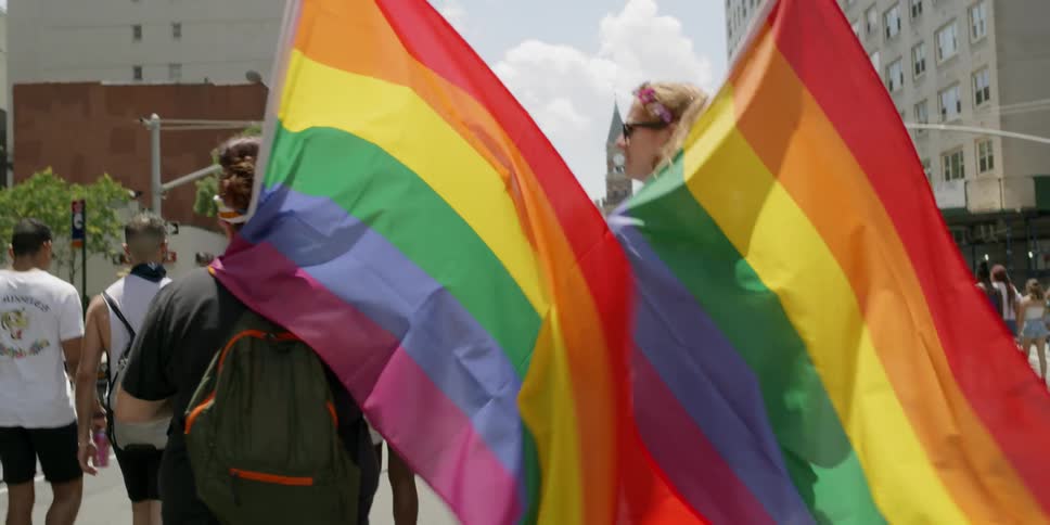 People march with gay pride flags
