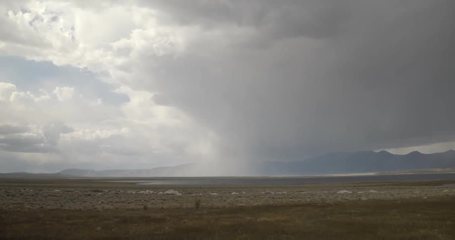 Storm clouds pass above the plains