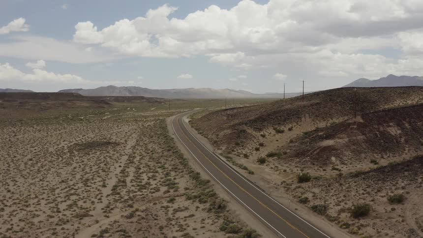 Camera rises above highway to reveal the horizon