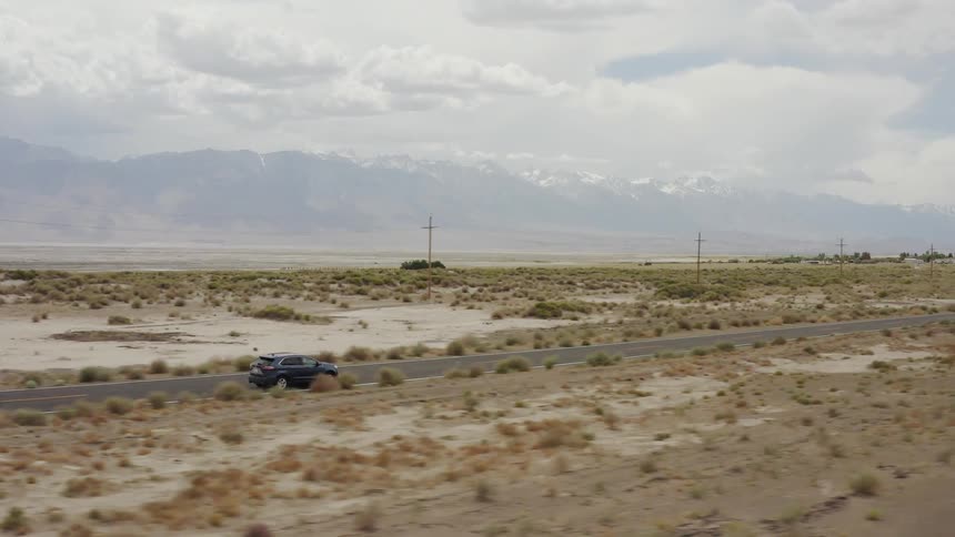 A truck drives on the rural road