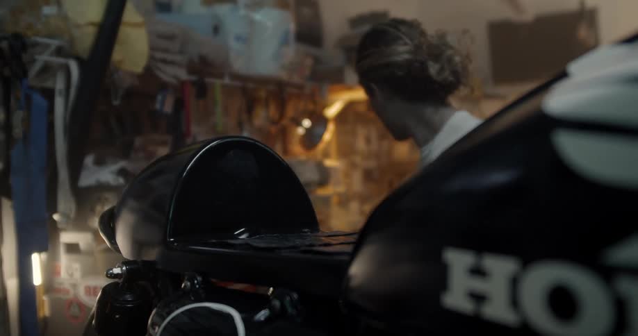 A man works on a motorcycle