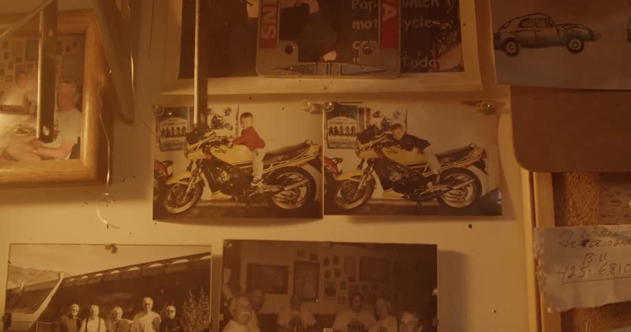 Old photographs pinned to a wall